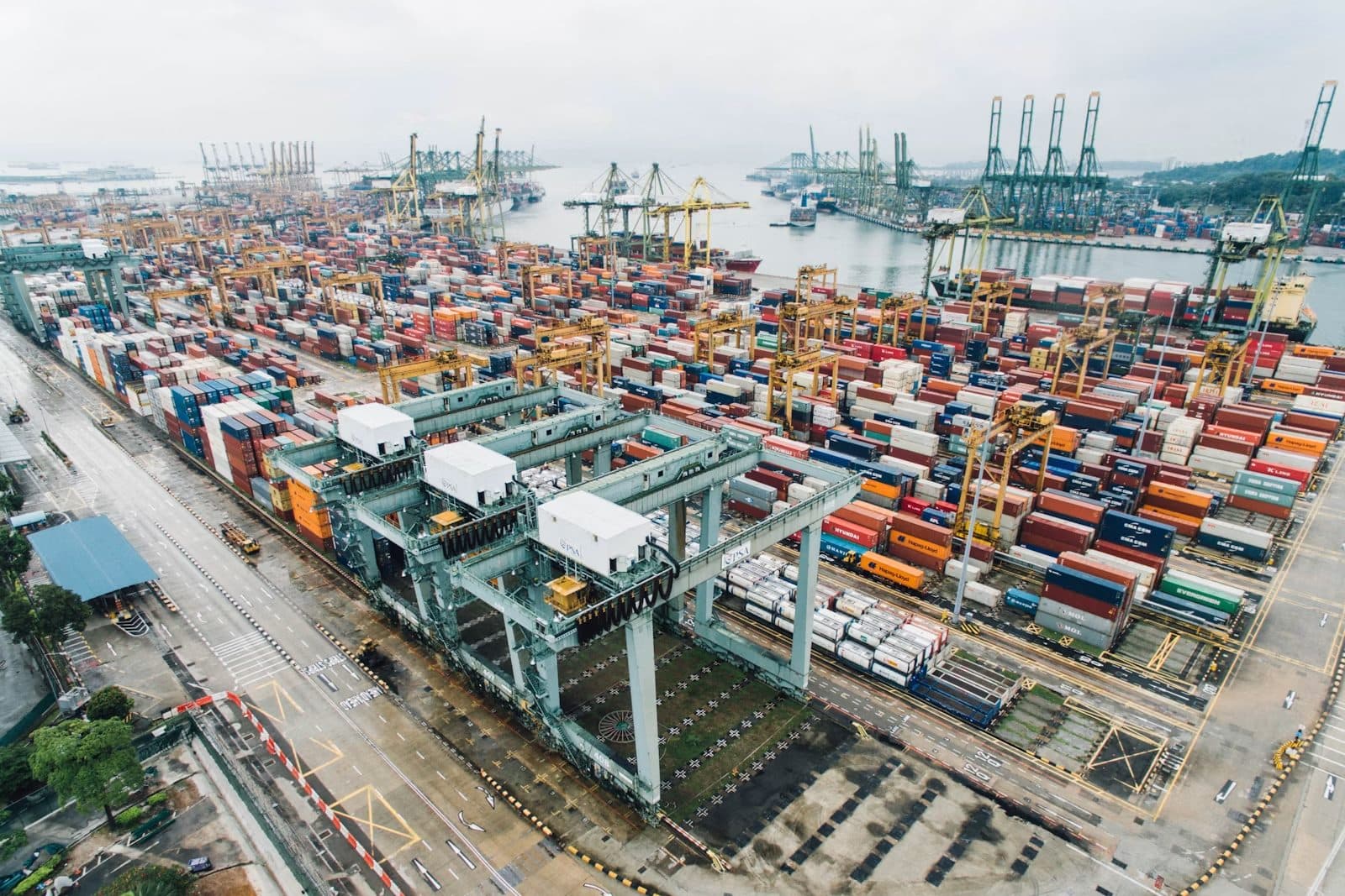 Container terminal with port cranes at a busy shipping harbour